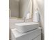 Modern bathroom showcasing a sleek sink with a stylish mirror and white cabinetry, creating a clean aesthetic at 1350 S Greenfield Rd # 1125, Mesa, AZ 85206