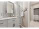 Bathroom with white subway tile, cabinet storage and a stylish mirror above the sink for getting ready at 1350 S Greenfield Rd # 1125, Mesa, AZ 85206