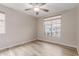 Bright bedroom with wood-look floors and windows offering views of the home's exterior at 1350 S Greenfield Rd # 1125, Mesa, AZ 85206