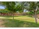 A lush green community park with mature trees, providing a serene and inviting outdoor space at 1350 S Greenfield Rd # 1125, Mesa, AZ 85206
