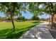 Enjoy the scenic community park with lush green lawns, trees, and walking paths, ideal for outdoor activities and relaxation at 1350 S Greenfield Rd # 1125, Mesa, AZ 85206