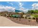 Community pool with lounge chairs, shade structures and landscaping creating a perfect spot to relax poolside at 1350 S Greenfield Rd # 1125, Mesa, AZ 85206