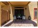 Cozy covered patio with comfortable seating, offering a shaded retreat with charming decorations and outdoor ambiance at 1350 S Greenfield Rd # 1125, Mesa, AZ 85206