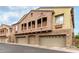 Attractive home exterior displaying a multi-car garage, upper balconies, and a well-maintained facade at 1350 S Greenfield Rd # 1125, Mesa, AZ 85206