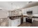 Open-concept kitchen featuring an island, stainless steel appliances, granite counters, and an inviting connected living space at 1350 S Greenfield Rd # 1125, Mesa, AZ 85206