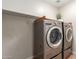 Efficient laundry room with high-end, stainless-steel washer and dryer set at 1350 S Greenfield Rd # 1125, Mesa, AZ 85206