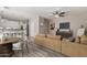 Inviting living room with modern furnishings, wood-style flooring, and an open layout connecting to the kitchen area at 1350 S Greenfield Rd # 1125, Mesa, AZ 85206