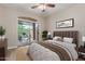 Serene main bedroom featuring neutral tones, a comfortable bed, and a sliding glass door to a private patio at 1350 S Greenfield Rd # 1125, Mesa, AZ 85206