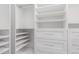 Bright walk-in closet featuring custom shelving and drawers for optimal storage and organization at 1350 S Greenfield Rd # 1125, Mesa, AZ 85206
