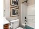 Cozy bathroom showcases a white tub/shower, framed artwork, and modern fixtures at 1361 N Claiborne --, Mesa, AZ 85205