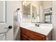 Bathroom vanity features a white countertop, wood cabinets, modern faucet and towel rack at 1361 N Claiborne --, Mesa, AZ 85205