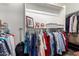 The closet is fully stocked with clothing and accessories, with shelves for storage at 1361 N Claiborne --, Mesa, AZ 85205