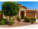 Charming single-story home featuring a well-maintained front yard and a two-car garage at 1361 N Claiborne --, Mesa, AZ 85205