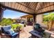 Gazebo with outdoor seating and backyard views with grass and outdoor kitchen at 1361 N Claiborne --, Mesa, AZ 85205