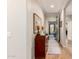 Hallway featuring hardwood floors, a dresser, a table lamp, and neutral wall paint at 1361 N Claiborne --, Mesa, AZ 85205