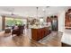 Spacious open floor plan kitchen with stainless steel appliances and bar seating at 1361 N Claiborne --, Mesa, AZ 85205