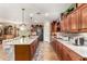 Gourmet kitchen with granite counters, custom cabinets, and stainless steel appliances at 1361 N Claiborne --, Mesa, AZ 85205