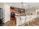 Beautiful kitchen with granite countertops, stainless appliances, and large center island with seating at 1361 N Claiborne --, Mesa, AZ 85205