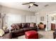 Inviting living room featuring a plush leather sofa, ottoman, and neutral tones at 1361 N Claiborne --, Mesa, AZ 85205