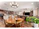 Open floor plan with kitchen, living, and dining areas all in one great room at 1361 N Claiborne --, Mesa, AZ 85205