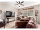 This living room features comfortable leather seating and large windows at 1361 N Claiborne --, Mesa, AZ 85205