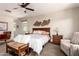 Comfortable main bedroom with ceiling fan, large bed, and decor at 1361 N Claiborne --, Mesa, AZ 85205
