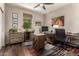 A well-lit office space with a large desk, natural light, and stylish decor at 1361 N Claiborne --, Mesa, AZ 85205