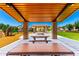 Sheltered picnic tables offer shade and seating at the community's playground at 1361 N Claiborne --, Mesa, AZ 85205