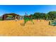 Community playground with climbing equipment, swings, and covered picnic area in the background at 1361 N Claiborne --, Mesa, AZ 85205