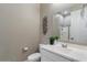 Bathroom features white vanity with granite countertop and decorative touches at 14634 W Wethersfield Rd, Surprise, AZ 85379
