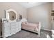 Bedroom with a dresser, vanity with mirror, and a comfortable bed at 14634 W Wethersfield Rd, Surprise, AZ 85379