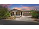 Beautiful single-Gathering home featuring a two-car garage and landscaped front yard, perfect for suburban living at 14634 W Wethersfield Rd, Surprise, AZ 85379