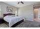 Spacious main bedroom with a king bed, soft carpet, and natural light from windows at 14634 W Wethersfield Rd, Surprise, AZ 85379