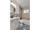 Updated bathroom features modern fixtures, stylish tile, and a shower-tub combination at 1529 E Edgemont Ave, Phoenix, AZ 85006