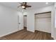 Cozy bedroom with ceiling fan, wood-look floors, and a spacious closet at 1529 E Edgemont Ave, Phoenix, AZ 85006