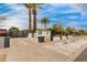 Charming single-story home featuring a white exterior, desert landscaping, and mature palm trees at 1529 E Edgemont Ave, Phoenix, AZ 85006