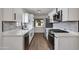 Bright kitchen with white cabinets, stainless steel appliances, and stylish backsplash at 1529 E Edgemont Ave, Phoenix, AZ 85006