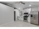 Open kitchen with stainless steel appliances, white cabinets, and tiled backsplash at 1529 E Edgemont Ave, Phoenix, AZ 85006