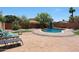 Beautiful backyard featuring a pool, patio, and lounge seating, ideal for enjoying sunny days and outdoor living at 15365 W Valentine St, Surprise, AZ 85379