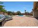 Wonderful backyard boasts a pool, patio, grill, and outdoor seating perfect for entertaining and relaxation at 15365 W Valentine St, Surprise, AZ 85379