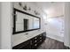 Well-lit bathroom with double sinks, a large mirror, and a shower/tub combo at 15365 W Valentine St, Surprise, AZ 85379