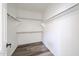 Walk-in closet with wood-style flooring and shelving perfect for storage at 15365 W Valentine St, Surprise, AZ 85379