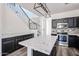 Contemporary kitchen showcasing granite countertops, stainless steel appliances, dark wood cabinets, and a breakfast bar at 15365 W Valentine St, Surprise, AZ 85379