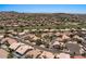 Aerial view of a residential neighborhood showcasing well-maintained homes, mature trees, and a nearby golf course at 15829 S 13Th Pl, Phoenix, AZ 85048