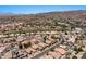 An aerial view of lovely homes with private pools, lush landscaping, solar panels and mountain views in a golf community at 15829 S 13Th Pl, Phoenix, AZ 85048