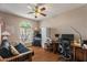 Bedroom featuring a large window, desk area, ceiling fan, and hardwood floors at 15829 S 13Th Pl, Phoenix, AZ 85048