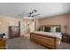 Spacious bedroom with neutral paint, a ceiling fan, and carpeted floors at 15829 S 13Th Pl, Phoenix, AZ 85048