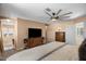 Spacious bedroom with neutral paint, a ceiling fan, and carpeted floors at 15829 S 13Th Pl, Phoenix, AZ 85048