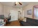 Bedroom featuring a dark futon, office area, ceiling fan, and hardwood floors at 15829 S 13Th Pl, Phoenix, AZ 85048