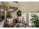 Private courtyard featuring mature plants, a seating area, and a view of the stairs to the second level at 15829 S 13Th Pl, Phoenix, AZ 85048